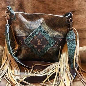 Beautiful cowhide crossbody with authentic lv